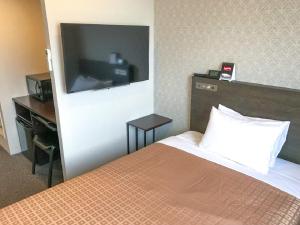 Letto o letti in una camera di HOTEL LiVEMAX Chiba Chuo-Ekimae
