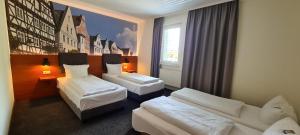Llit o llits en una habitació de EuroHotel Günzburg