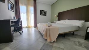 Een bed of bedden in een kamer bij Hotel La Parra