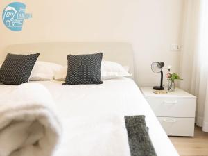 Łóżko lub łóżka w pokoju w obiekcie Imbriani 4 Tirabora Short Rent