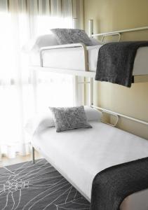 Posteľ alebo postele v izbe v ubytovaní Barcelona Apartment Gran de Gràcia
