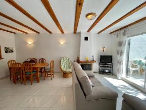 a living room with a couch and a table at Bungalow Mar W1B02 in Benitachell