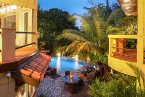 an image of a swimming pool in a resort at La Villa Boutique Hotel in Accra