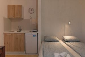 Postel nebo postele na pokoji v ubytování Apartmani LUKA Perućac