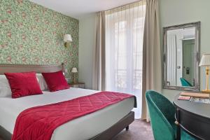 Ένα ή περισσότερα κρεβάτια σε δωμάτιο στο Hôtel de Sèvres
