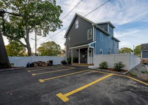 a large blue house with a parking lot at 284-Newbuilt Entire House with free huge parking lot in Quincy