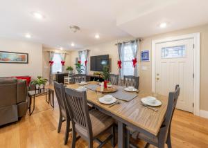 a dining room and living room with a table and chairs at 284 - 5BR Boston - Peaceful House near England Aqua in Quincy