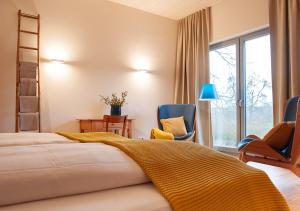 Cama o camas de una habitación en FELDGANG ein Gästehaus!