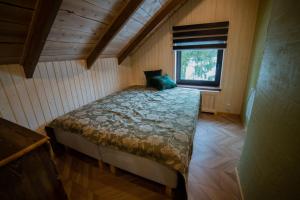 Postel nebo postele na pokoji v ubytování Tuimõisa Puhketalu