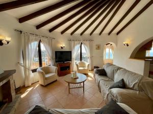 A television and/or entertainment centre at Villa María - Salco la Cumbre