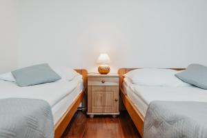 Posteľ alebo postele v izbe v ubytovaní Willa Ostoja