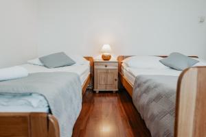 Posteľ alebo postele v izbe v ubytovaní Willa Ostoja