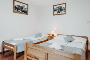 Posteľ alebo postele v izbe v ubytovaní Willa Ostoja