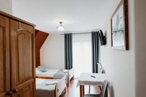 Ένα ή περισσότερα κρεβάτια σε δωμάτιο στο Willa Ostoja