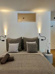 a bedroom with a large bed with two pillows at Apartmenthaus Stade Schwingewiesen Apartment 4 in Stade
