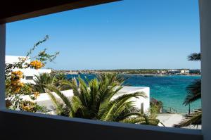 a view of the ocean from a hotel window at Hotel Roca Bella in Es Pujols