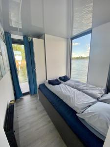 Llit o llits en una habitació de AquaHouse Zamkowe