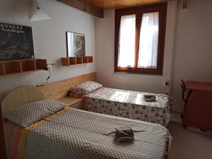 Ένα ή περισσότερα κρεβάτια σε δωμάτιο στο Il giglio vista mare
