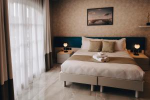 Letto o letti in una camera di Dock 1 Boutique Hotel