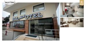 TireboluBAL Mini Hotel的侧面有标志的建筑物