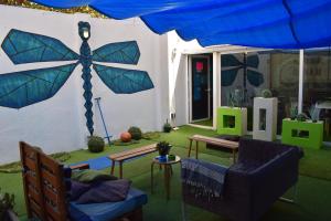 a living room with a large blue umbrella at Onefam Paralelo in Barcelona