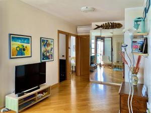 En tv och/eller ett underhållningssystem på Residence Laguna Giudecca