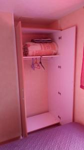 a pink room with a pink closet with a pink bag at Camping prés des Gorges du Verdon et Du Lac De Ste Croix 04500 Tout Equipé Confort Calme Lavande in Sainte-Croix-de-Verdon