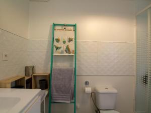 a bathroom with a toilet and a glass shower at La Pichona in Carlux