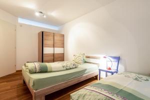 Posteľ alebo postele v izbe v ubytovaní Apartement Santner