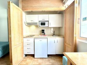 Kuchyň nebo kuchyňský kout v ubytování Apartamentos Park Plaza