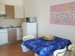 a kitchen with a table with a bowl on it at Apartments Magdalena AS1 in Rovinj