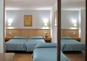 Postel nebo postele na pokoji v ubytování Apartamentos Park Plaza