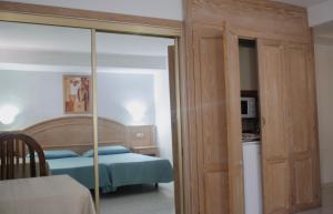 Postel nebo postele na pokoji v ubytování Apartamentos Park Plaza