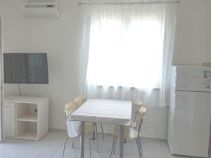 Televízia a/alebo spoločenská miestnosť v ubytovaní Apartments Magdalena AS1