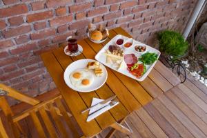 a table with two plates of breakfast food on it at İkiz Konak Boutique Hotel in Istanbul +33 photos
