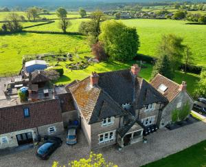 an aerial view of a large house with a yard at Knoll Hill Farm, The Place To Stay in Frome