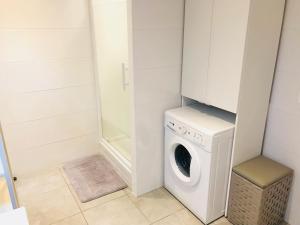 a washer and dryer in a small bathroom at Triangle d'or, 4 pers avec balcon in Le Touquet-Paris-Plage
