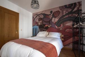 Un pat sau paturi într-o cameră la El Balcón de Teruel