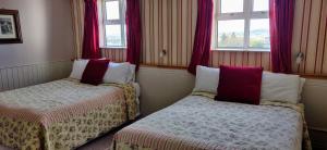 Voodi või voodid majutusasutuse Teac Campbell Guesthouse toas