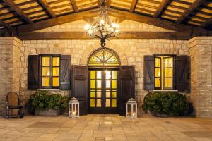 a building with a large doorway with a chandelier at Tenuta Vento di Mare in Lido Di Fondi