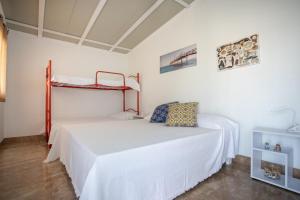 เตียงในห้องที่ Casetta Sul Mare