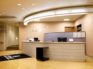 an empty lobby with a counter in a building at LiVEMAX RESORT Okudogo in Matsuyama +77 photos
