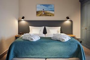 Ein Bett oder Betten in einem Zimmer der Unterkunft Lindner Strand Hotel Windrose