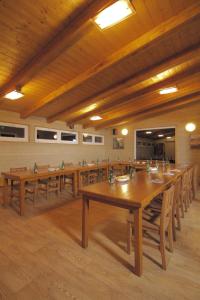 a large dining room with wooden tables and chairs at Pension U Lipy in Děčín