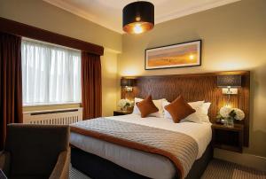 Krevet ili kreveti u jedinici u okviru objekta Glenroyal Hotel
