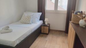 Postel nebo postele na pokoji v ubytování Apartment Frana DeLux