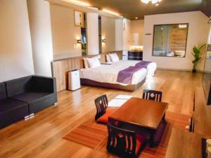 Postel nebo postele na pokoji v ubytování LiVEMAX RESORT Kusatsu Onsen