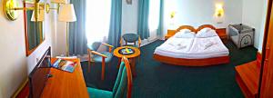 Posteľ alebo postele v izbe v ubytovaní Hotel Spindlerova Bouda