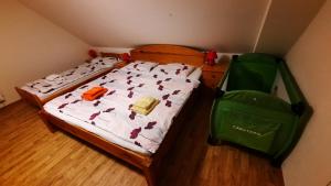 Llit o llits en una habitació de Podkroví v Jihočeském Statku