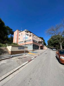 an empty street in front of a building at Apartmani Lorena in Pula